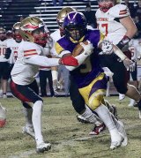 Lemoore's Kobe Green eludes a Centennial High defender for a short game in Friday night's exciting semifinal clash in Tiger Stadium.